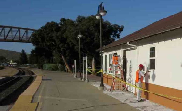 painters at work painting REA building